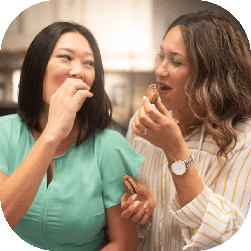  2 women eating during their Gaslamp walking food tour