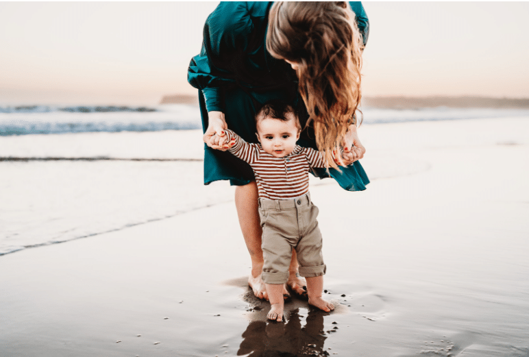 Mom with baby on a beach